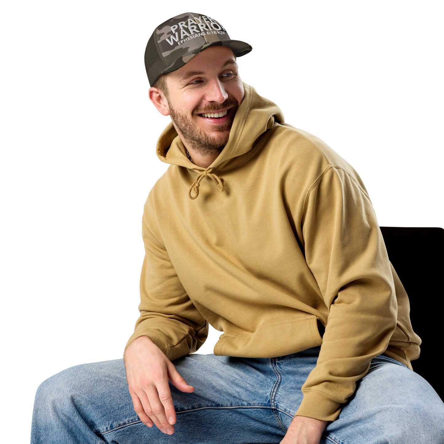 A person is wearing a Prayer Warrior camo trucker hat – Ephesians 6:18 KJV embroidered Christian cap, adjustable unisex design by ReBirth Living