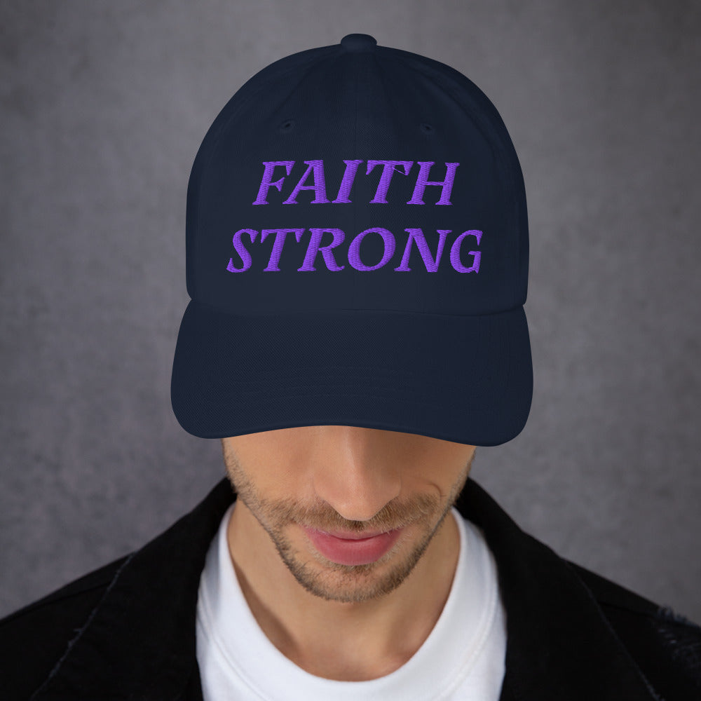Model is wearing a Faith Strong embroidered hat – bold purple text, navy adjustable unisex cap by ReBirth Living
