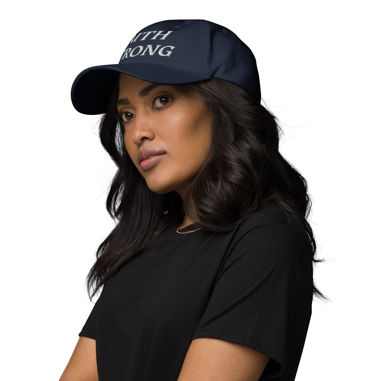 Person is wearing a Faith Strong cap – bold Christian statement hat, navy, with white embroidery, adjustable unisex design by ReBirth Living