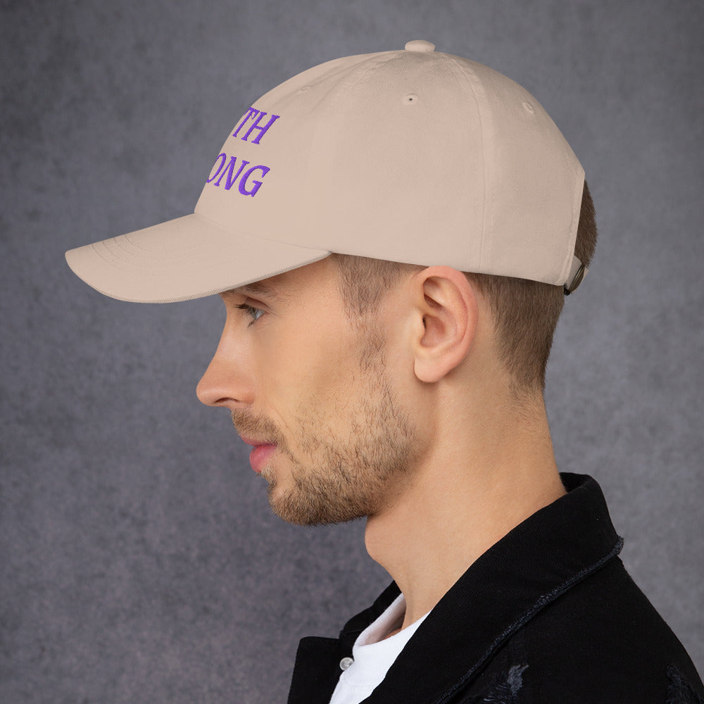 Model is wearing a Faith Strong embroidered hat – bold purple text, stone adjustable unisex cap by ReBirth Living