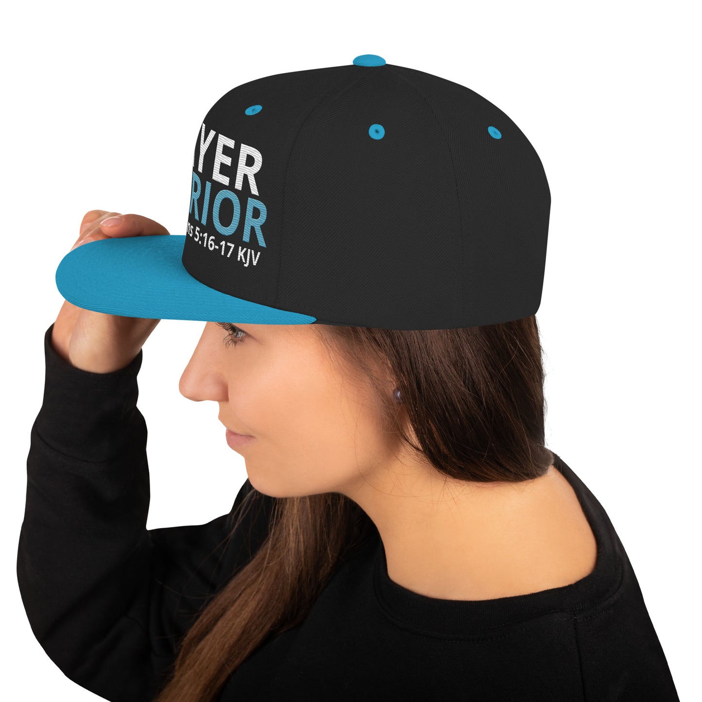 A person is wearing a Prayer Warrior snapback hat – 1 Thessalonians 5:16-17 KJV embroidered Christian cap, adjustable unisex design by ReBirth Living.