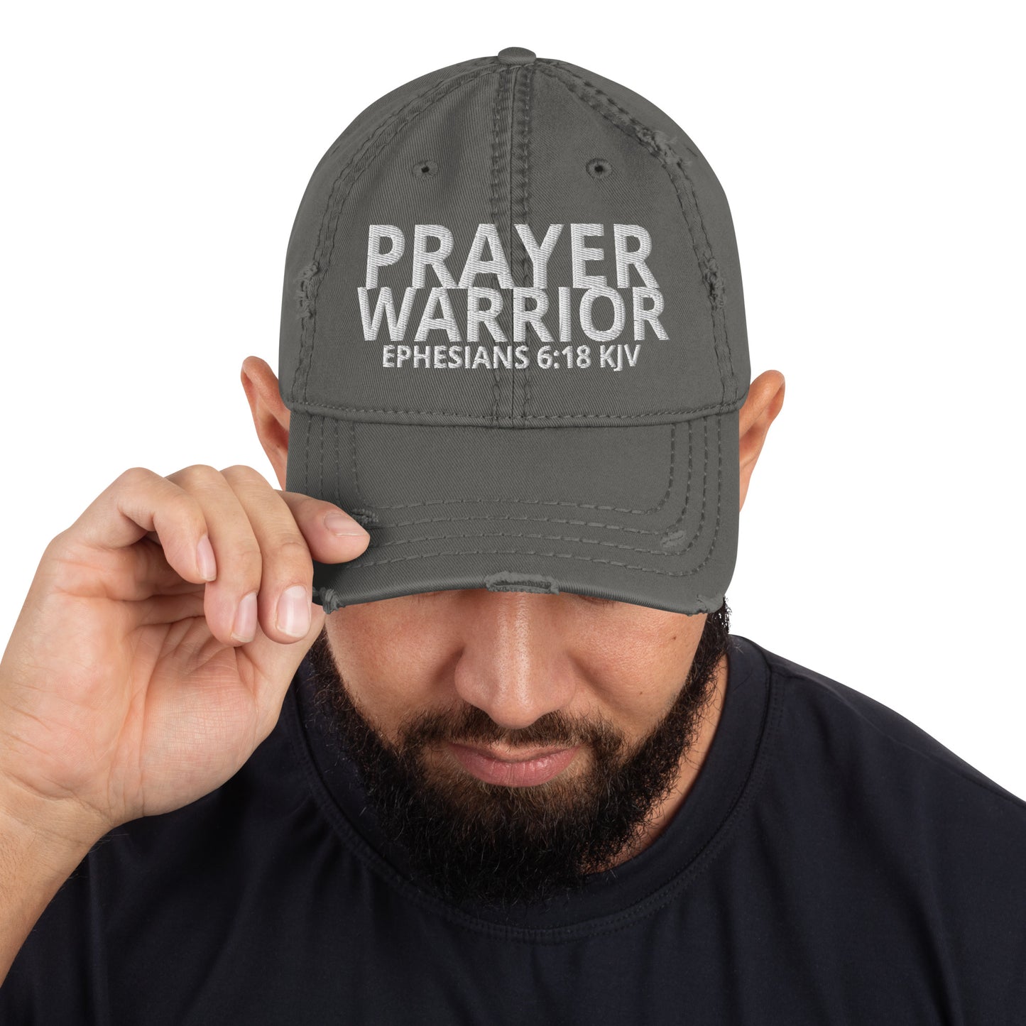 A person is wearing a Prayer Warrior Christian hat – distressed cap with Ephesians 6:18 KJV embroidered Bible verse, charcoal grey, adjustable unisex faith-based headwear by ReBirth Living
