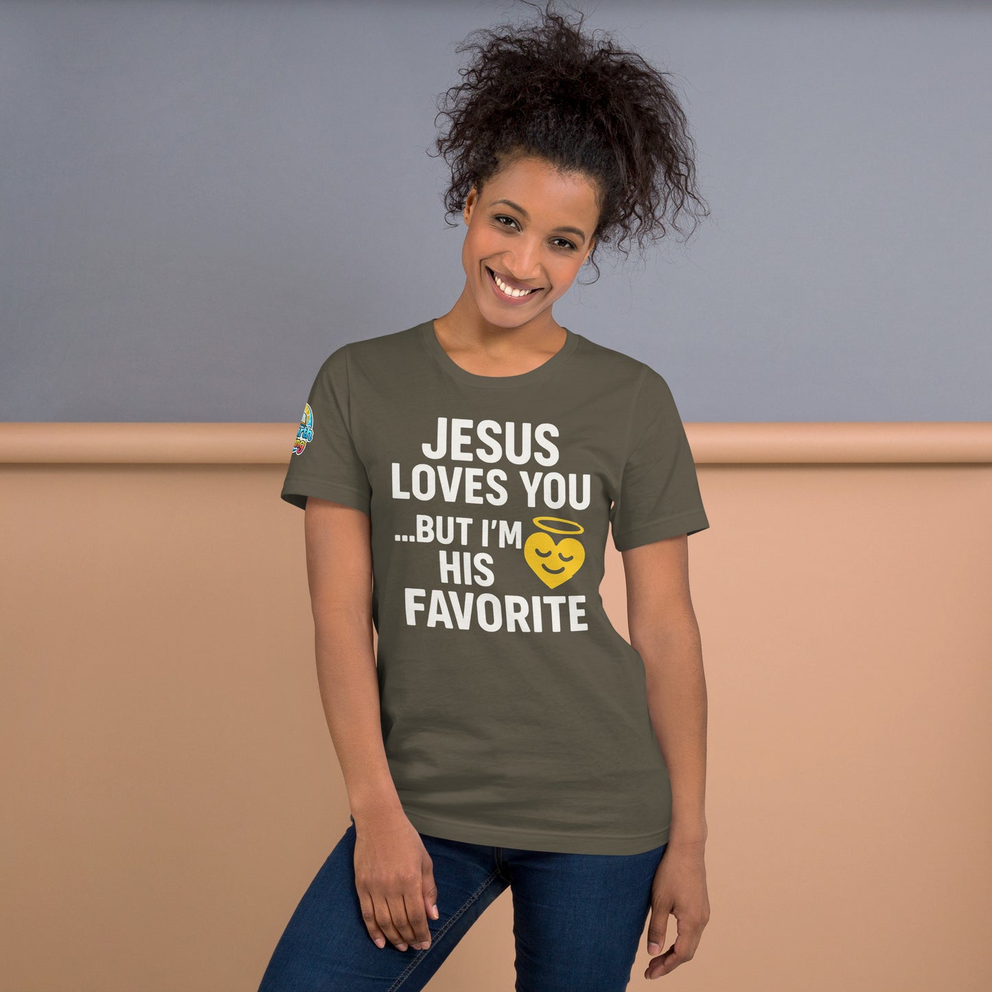 Model wearing “Jesus Loves You… But I’m His Favorite” – funny Christian t-shirt, army, faith humor design with golden smiling heart and halo by ReBirth Living