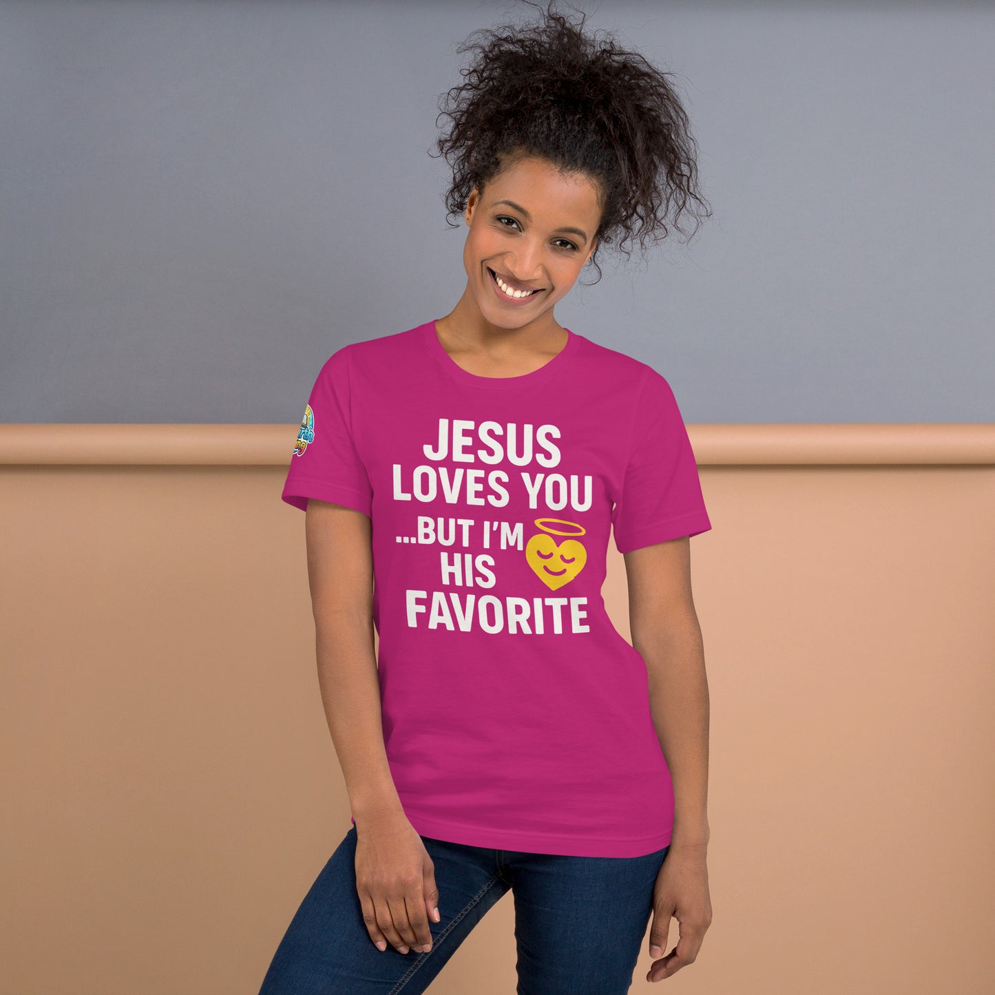 Model wearing “Jesus Loves You… But I’m His Favorite” – funny Christian t-shirt, berry, faith humor design with golden smiling heart and halo by ReBirth Living