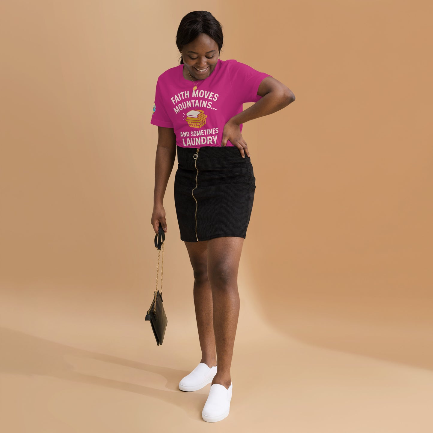 Model showcasing a Faith Moves Mountains… and Sometimes Laundry – funny Christian t-shirt, berry, faith-based humor design by ReBirth Living