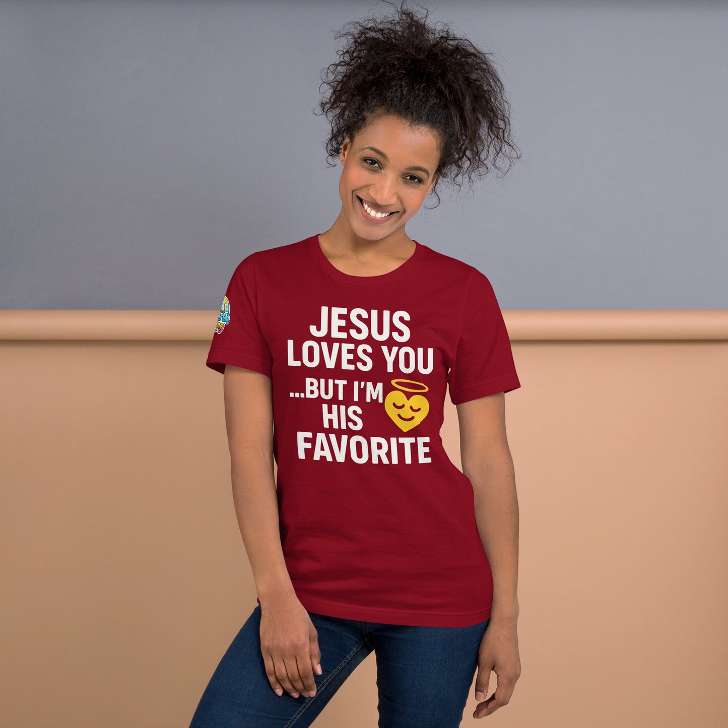 Model wearing “Jesus Loves You… But I’m His Favorite” – funny Christian t-shirt, cardinal, faith humor design with golden smiling heart and halo by ReBirth Living