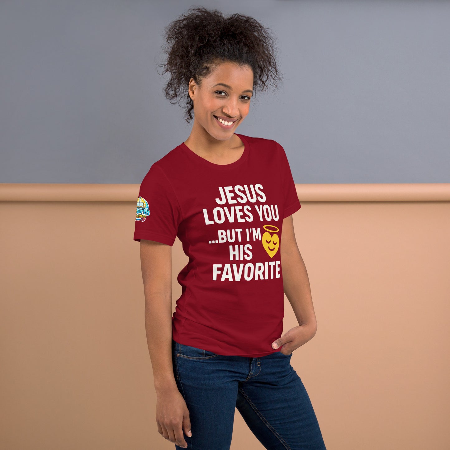 Model wearing “Jesus Loves You… But I’m His Favorite” – funny Christian t-shirt, cardinal, faith humor design with golden smiling heart and halo by ReBirth Living