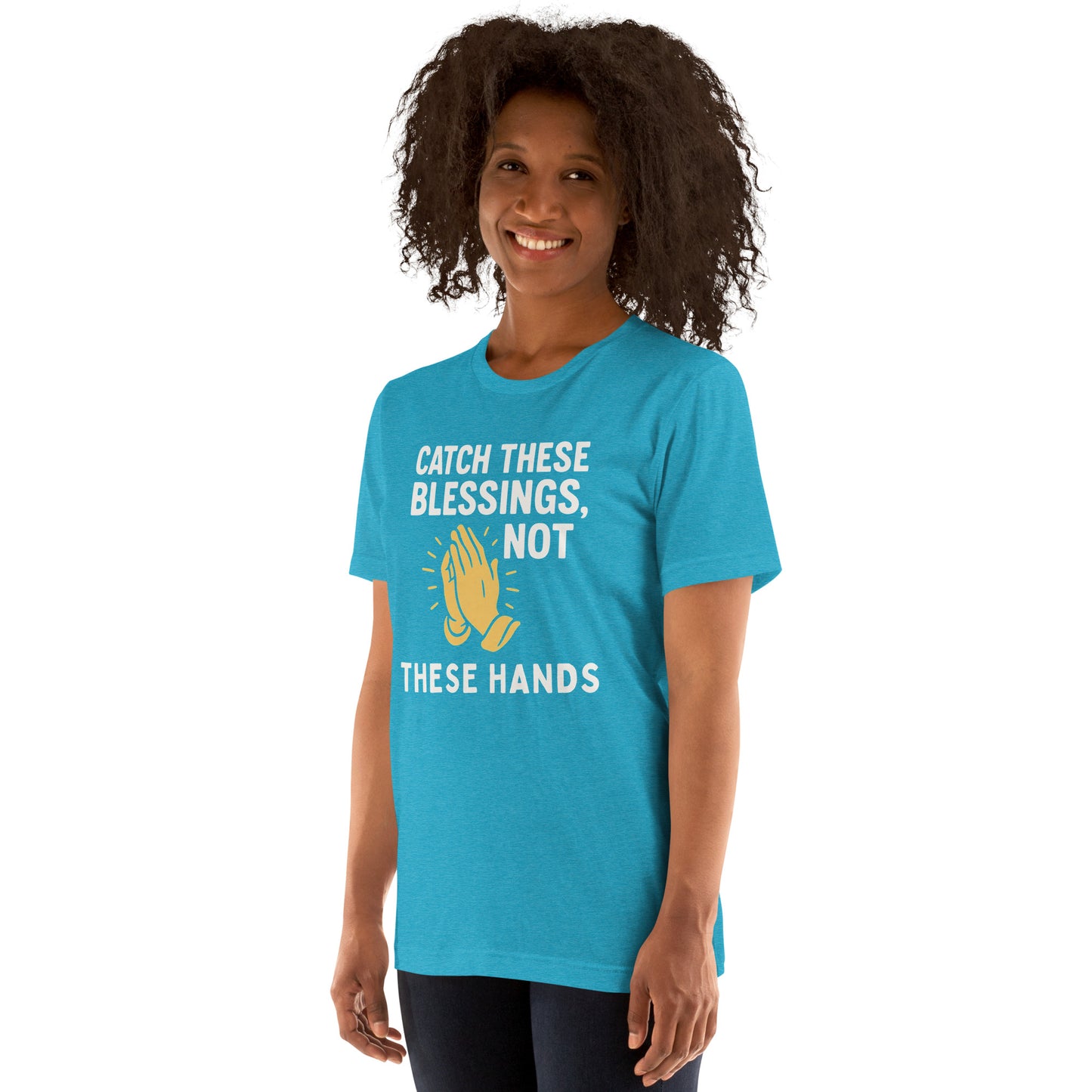Model showcasing a Catch These Blessings, Not These Hands – funny Christian t-shirt, heather aqua, faith-based humor design with prayer hands by ReBirth Living