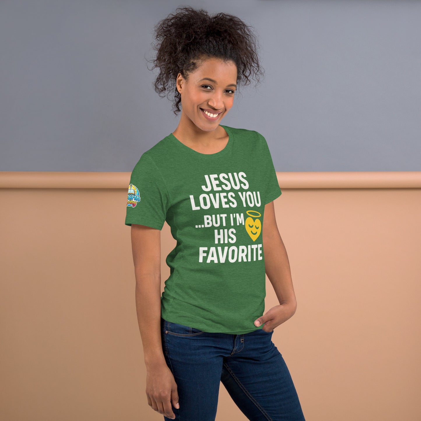 Model wearing “Jesus Loves You… But I’m His Favorite” – funny Christian t-shirt, heather grass green, faith humor design with golden smiling heart and halo by ReBirth Living