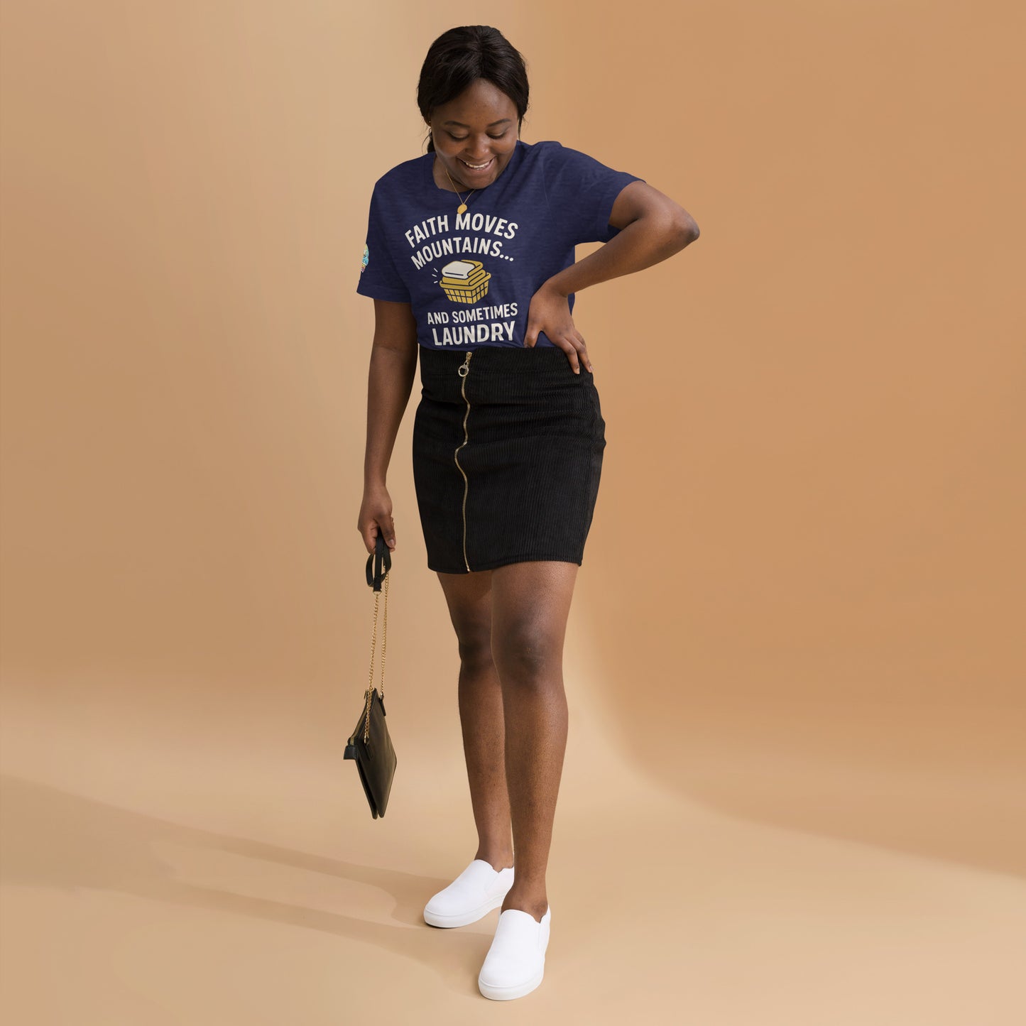 Model showcasing a Faith Moves Mountains… and Sometimes Laundry – funny Christian t-shirt, heather midnight navy, faith-based humor design by ReBirth Living