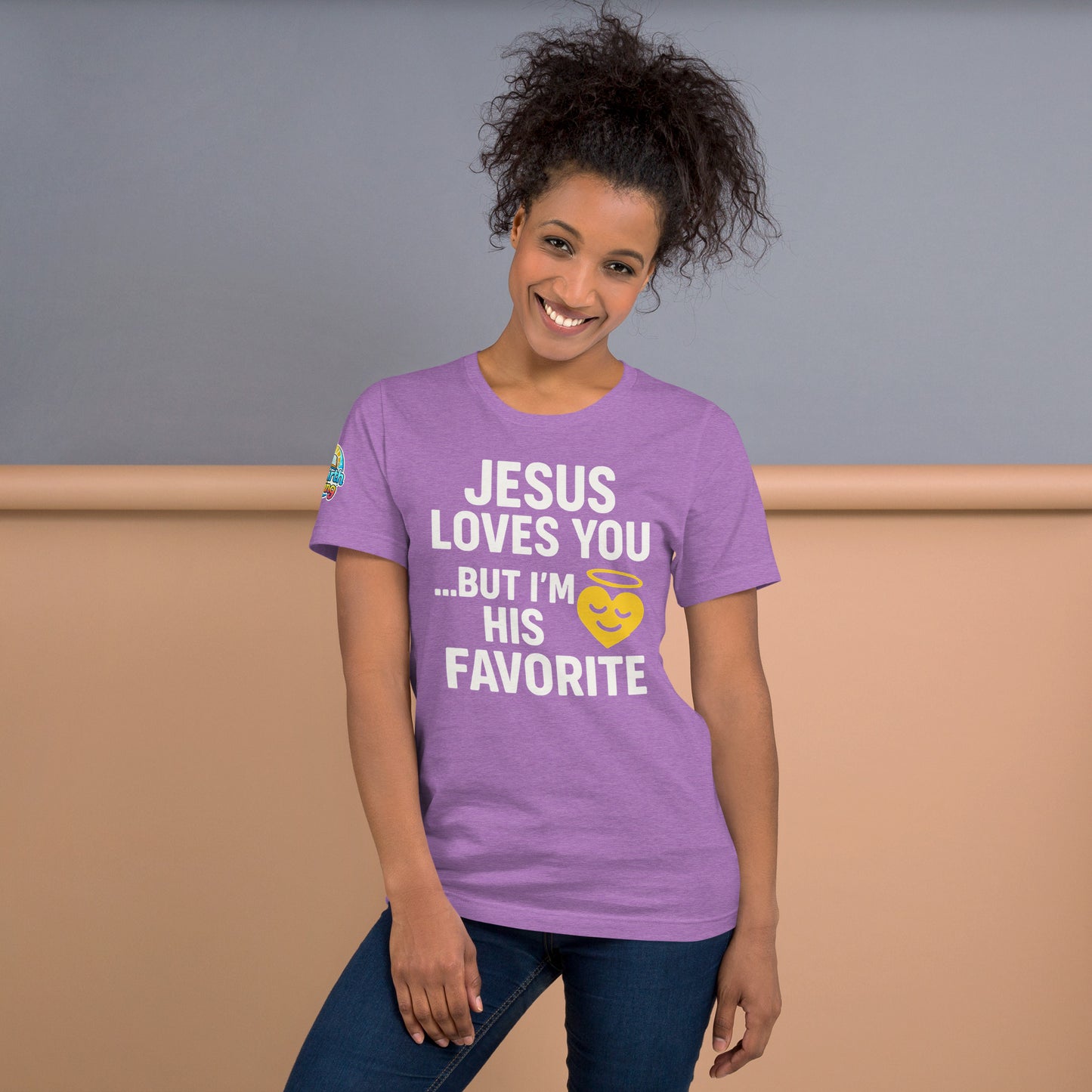 Model wearing “Jesus Loves You… But I’m His Favorite” – funny Christian t-shirt, heather team purple, faith humor design with golden smiling heart and halo by ReBirth Living