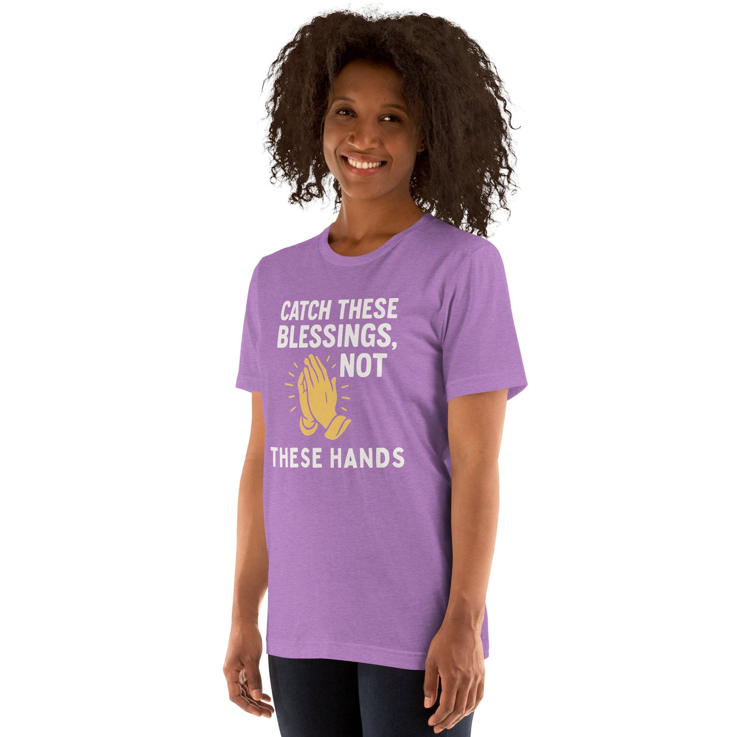 Model showcasing a Catch These Blessings, Not These Hands – funny Christian t-shirt, heather team purple, faith-based humor design with prayer hands by ReBirth Living