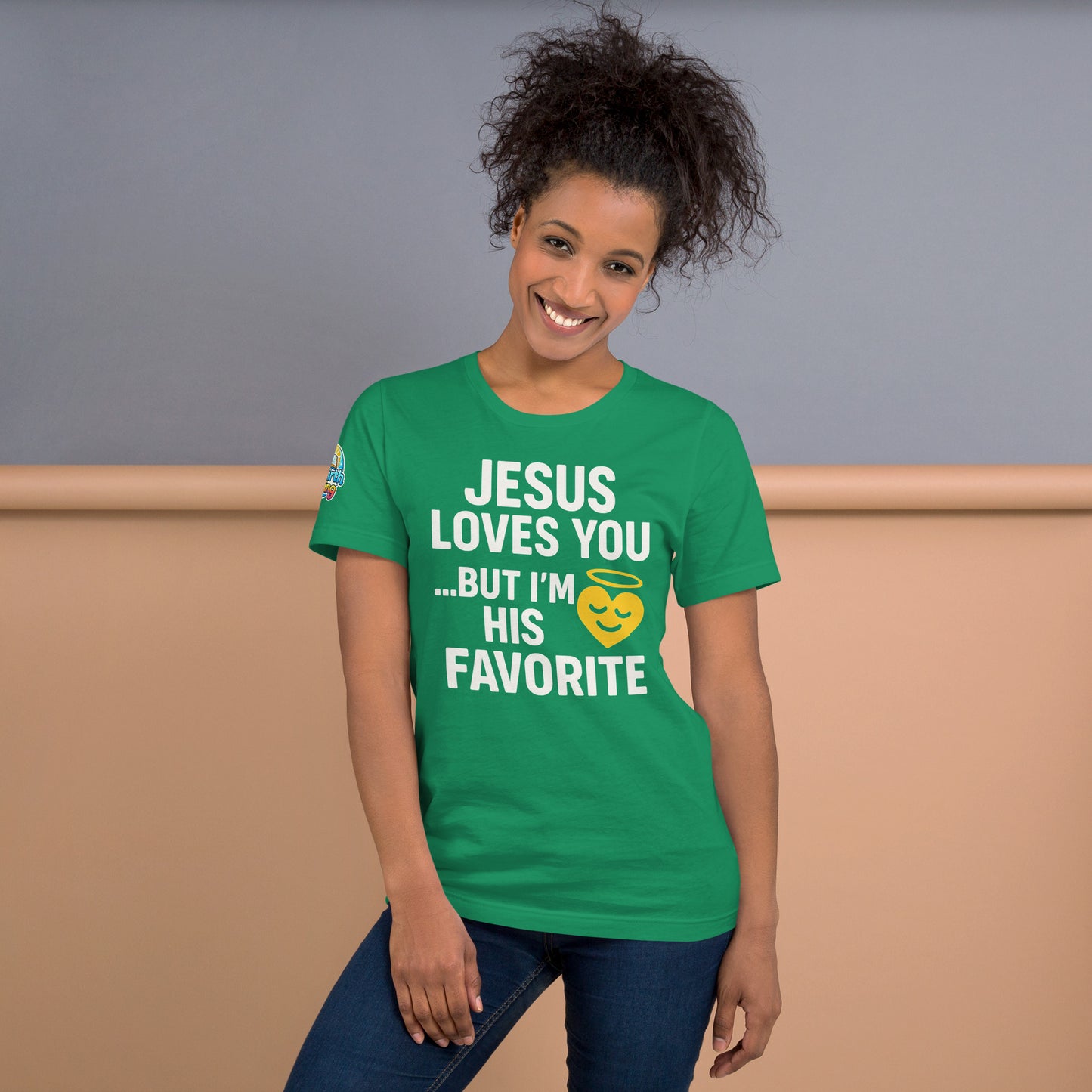 Model wearing “Jesus Loves You… But I’m His Favorite” – funny Christian t-shirt, kelly, faith humor design with golden smiling heart and halo by ReBirth Living