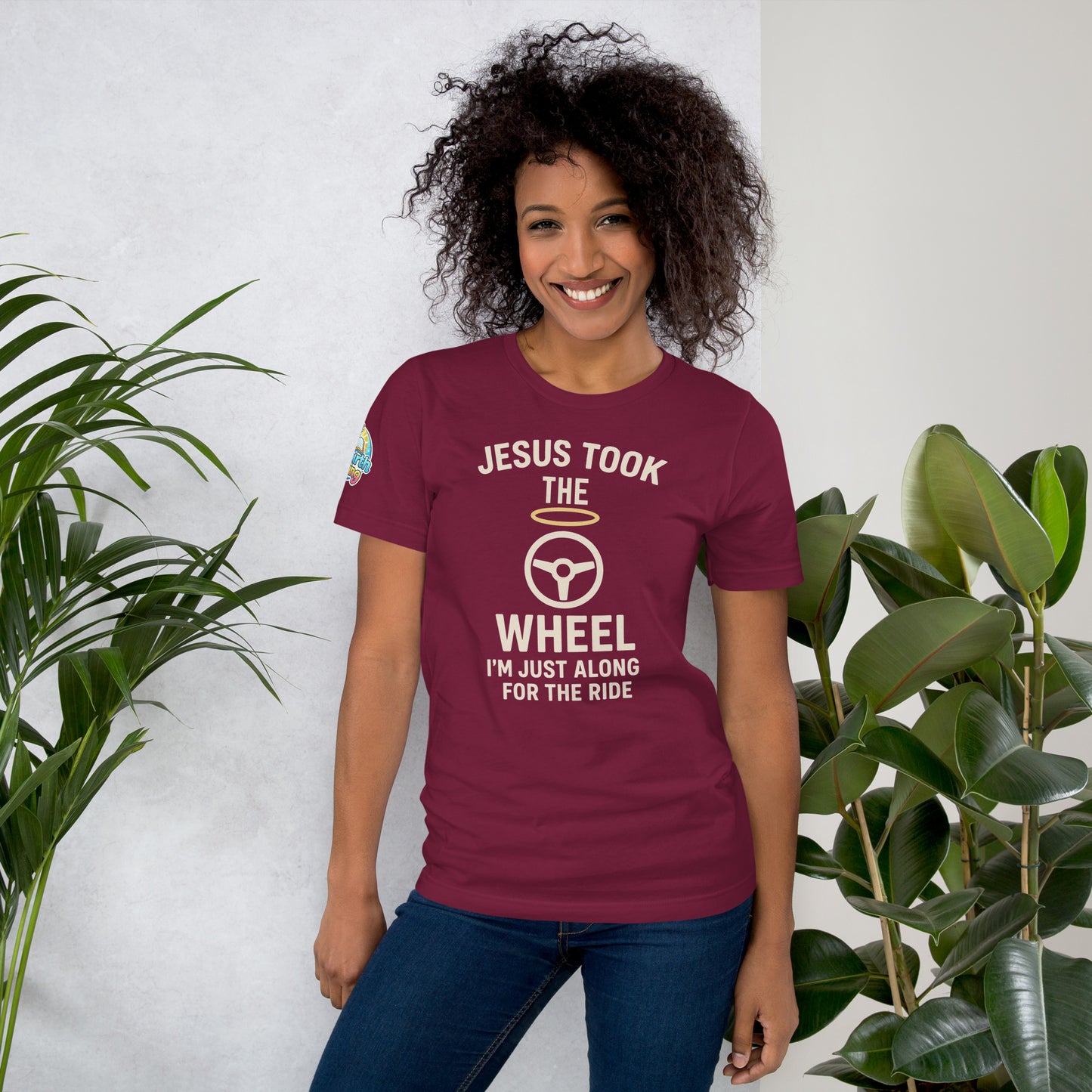 Model showcasing a Jesus Took the Wheel – I’m Just Along for the Ride – funny Christian t-shirt, maroon, faith humor design by ReBirth Living