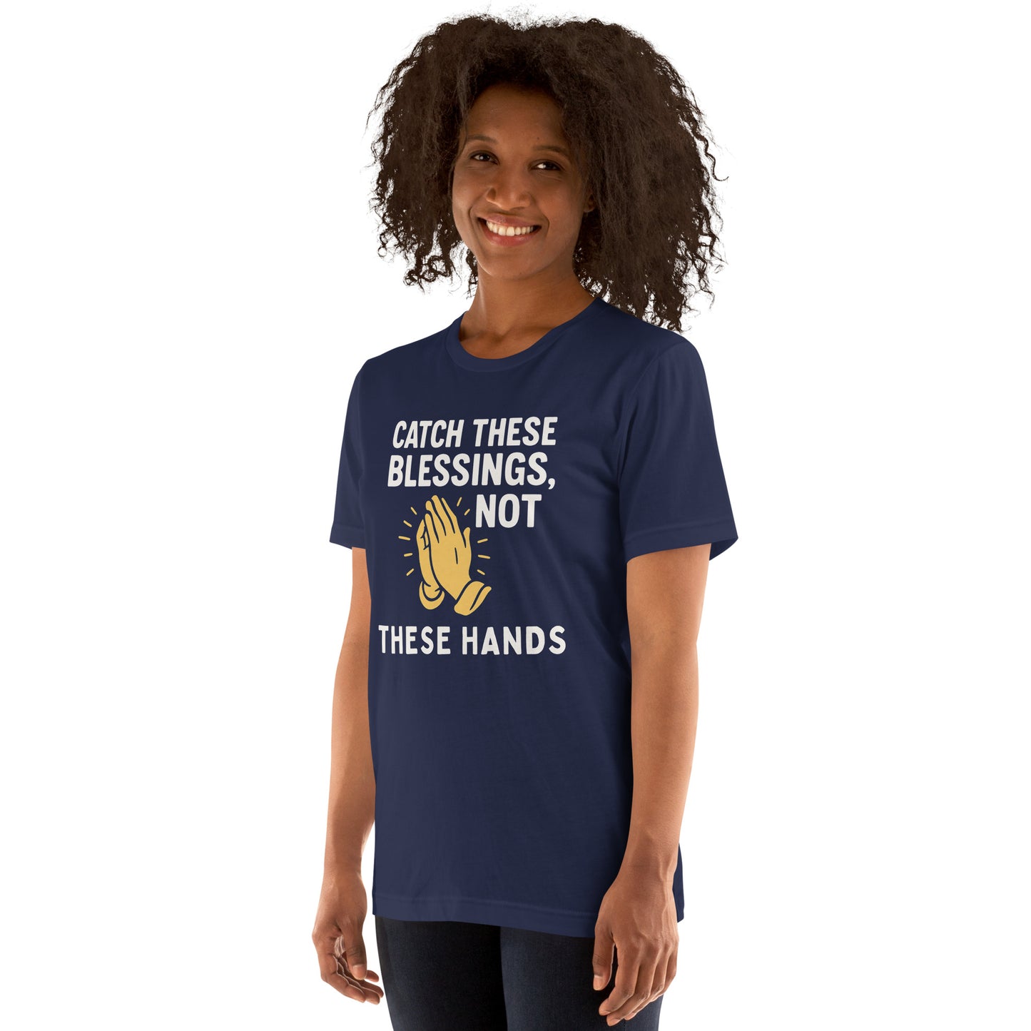 Model showcasing a Catch These Blessings, Not These Hands – funny Christian t-shirt, navy, faith-based humor design with prayer hands by ReBirth Living