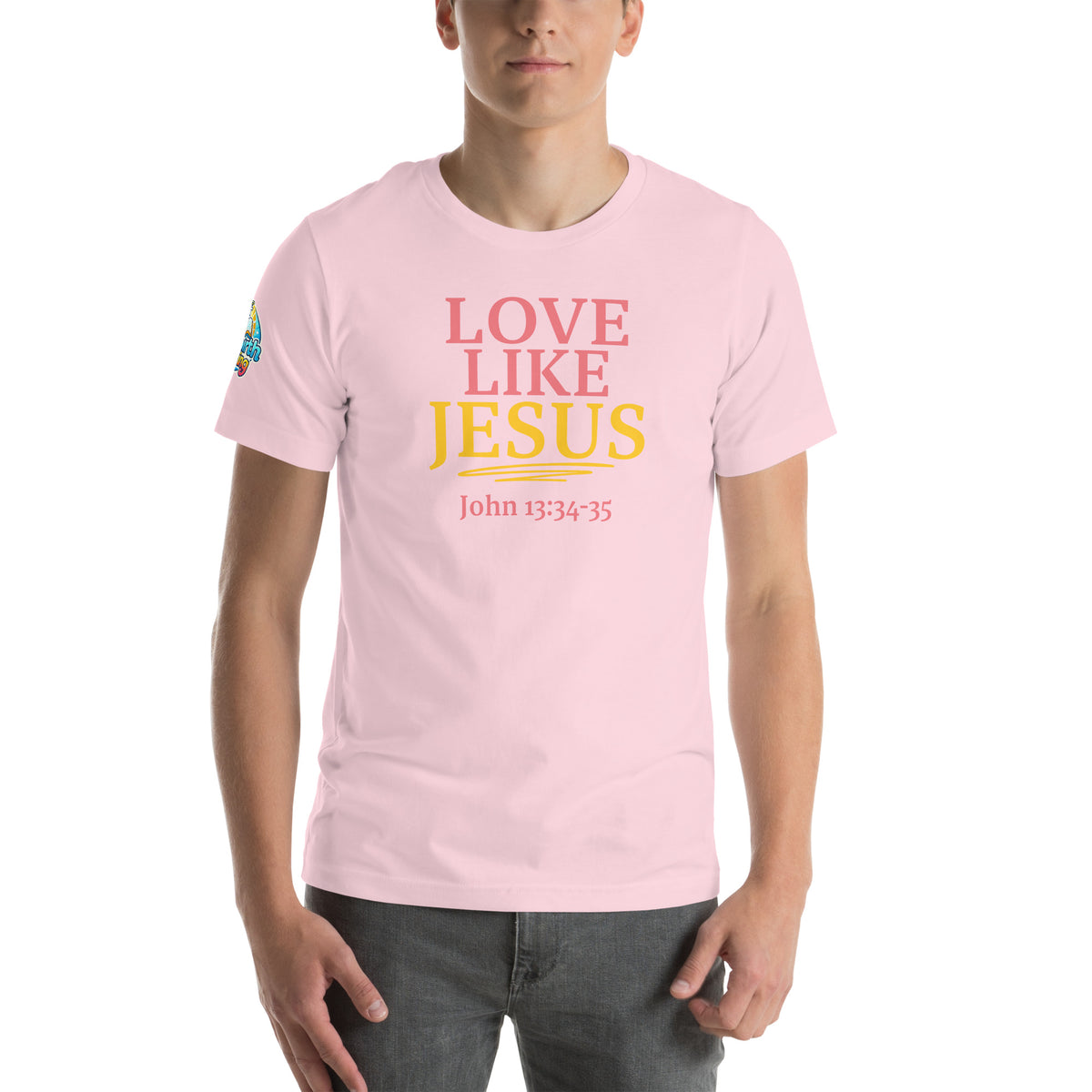 Product mockupA person is wearing a Love Like Jesus Christian t-shirt – bold faith graphic tee for men and women, pink, unisex design by ReBirth Living