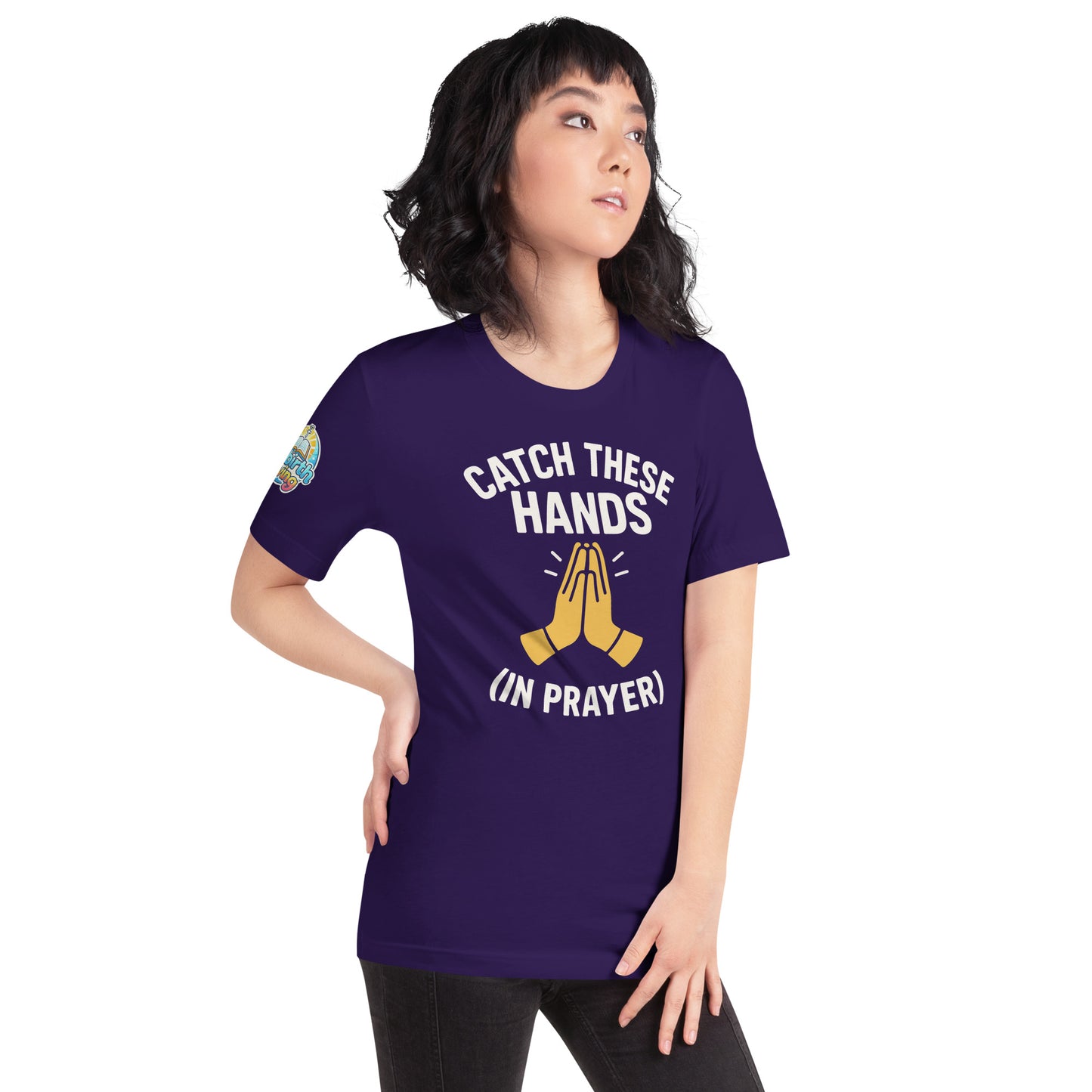 Model wearing “Catch These Hands (In Prayer)” – funny Christian t-shirt, team purple, faith-based humor design with golden praying hands by ReBirth Living