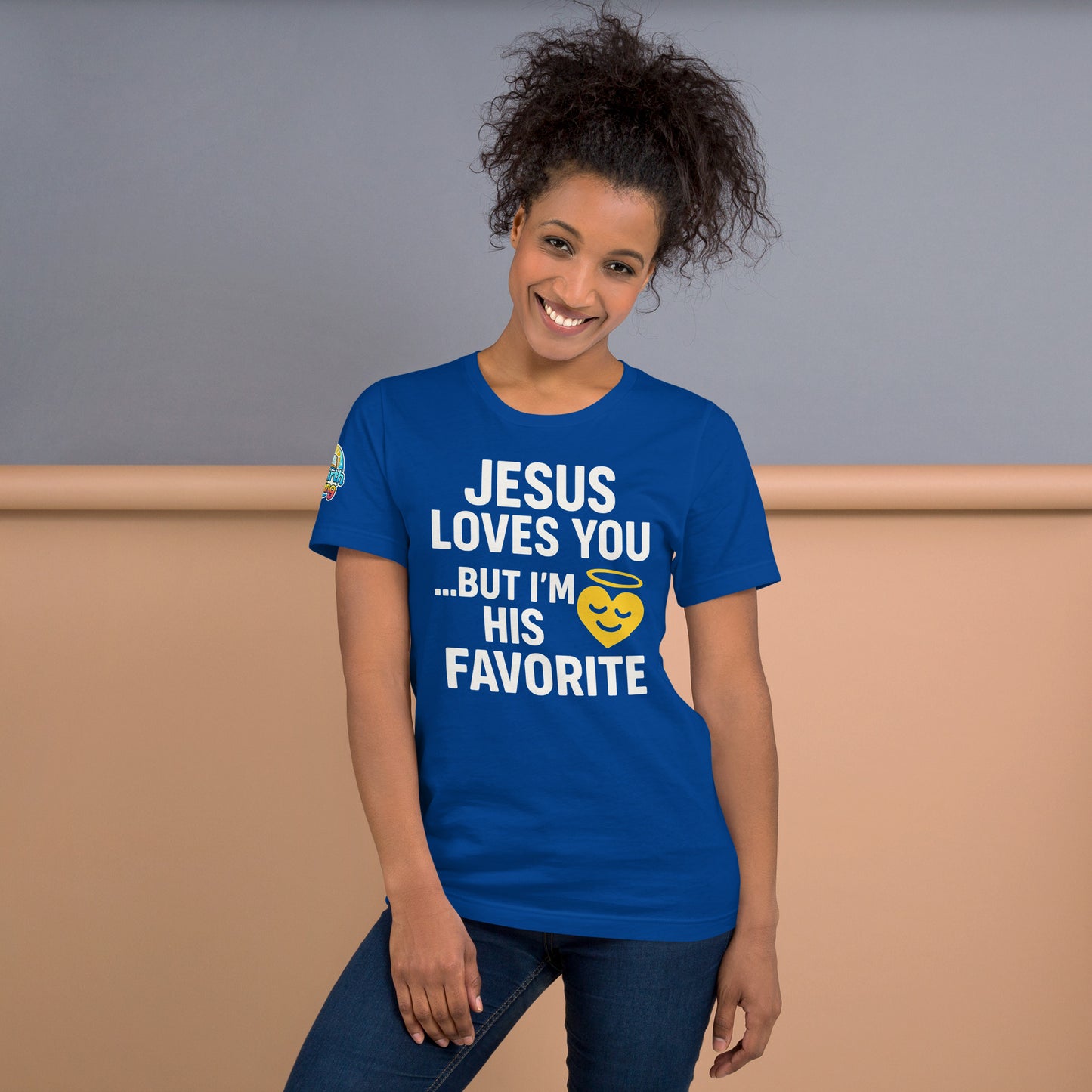 Model wearing “Jesus Loves You… But I’m His Favorite” – funny Christian t-shirt, true royal blue, faith humor design with golden smiling heart and halo by ReBirth Living
