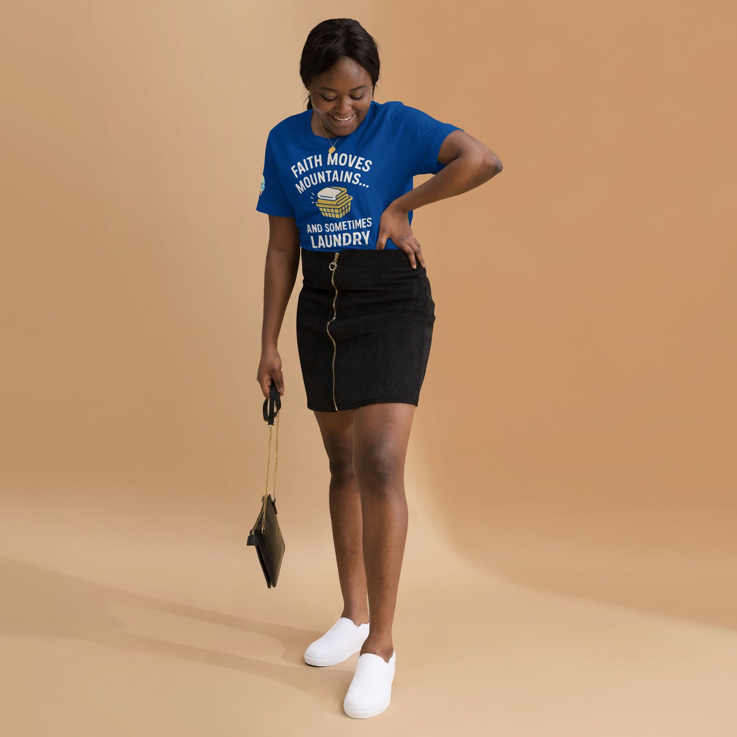 Model showcasing a Faith Moves Mountains… and Sometimes Laundry – funny Christian t-shirt, true royal, faith-based humor design by ReBirth Living