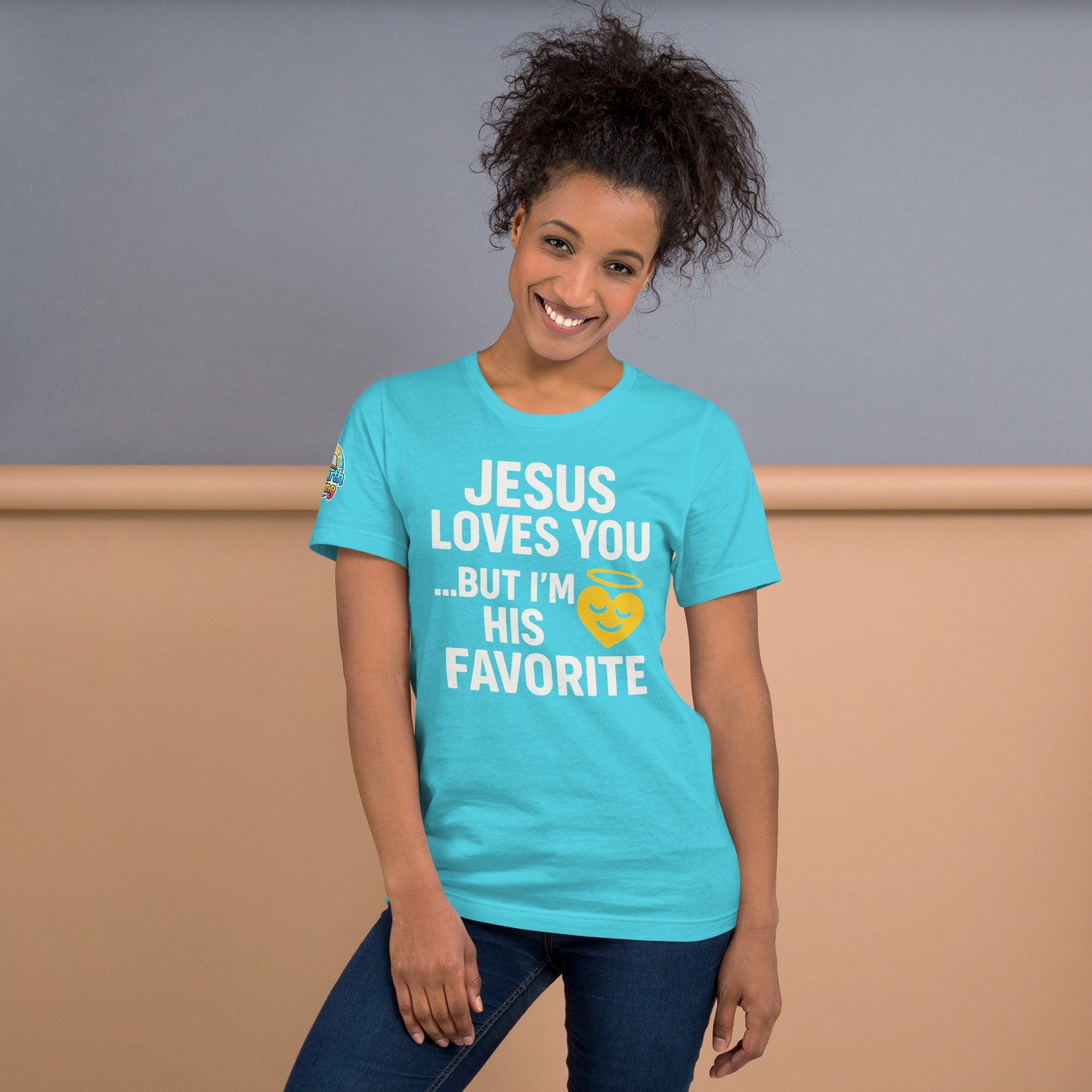 Model wearing “Jesus Loves You… But I’m His Favorite” – funny Christian t-shirt, turquoise, faith humor design with golden smiling heart and halo by ReBirth Living