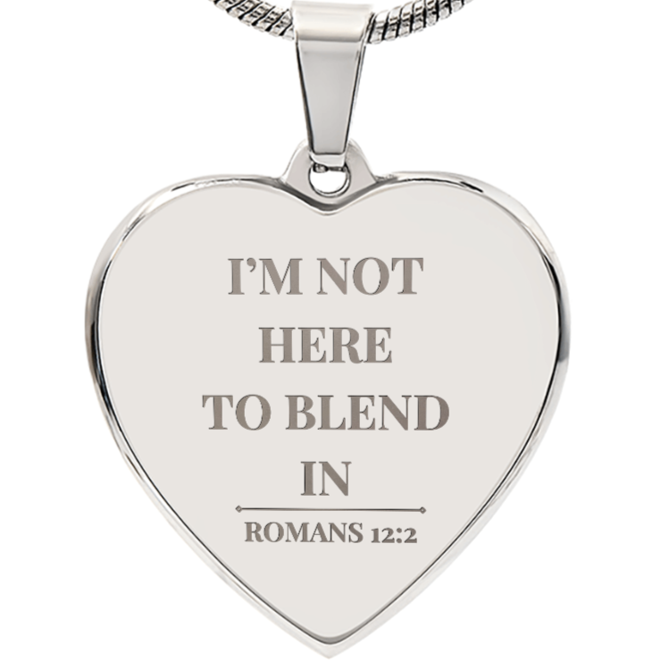 Heart-shaped silver pendant with engraved text on a white background by ReBirth Living