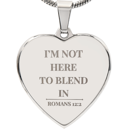 Heart-shaped silver pendant with engraved text on a white background by ReBirth Living