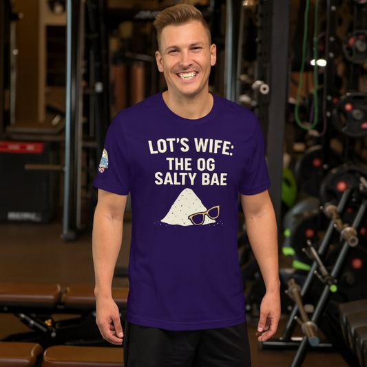 Man wearing a purple t-shirt with text and graphics in a gym setting.  Lot’s Wife: The OG Salty Bae – funny Christian t-shirt, purple, Bible humor design by ReBirth Living