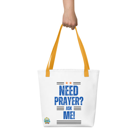 Person holding a white with blue text Need Prayer? Ask Me! – Christian tote bag for faith sharing and encouragement, reusable cotton carryall with a yellow handle by ReBirth Living