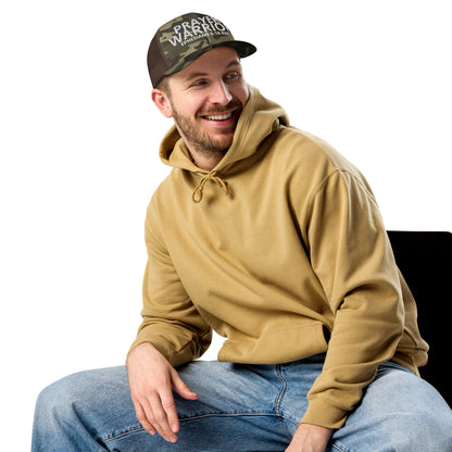 A person is wearing a Prayer Warrior camo trucker hat – Ephesians 6:18 KJV embroidered Christian cap, adjustable unisex design by ReBirth Living