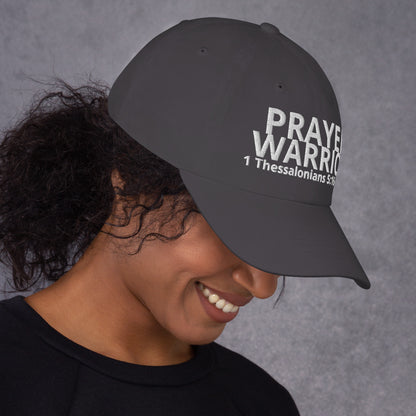 A person wearing a Prayer Warrior black cap – 1 Thessalonians 5:16–17 KJV embroidered Christian hat, adjustable unisex, grey, faith-based headwear by ReBirth Living