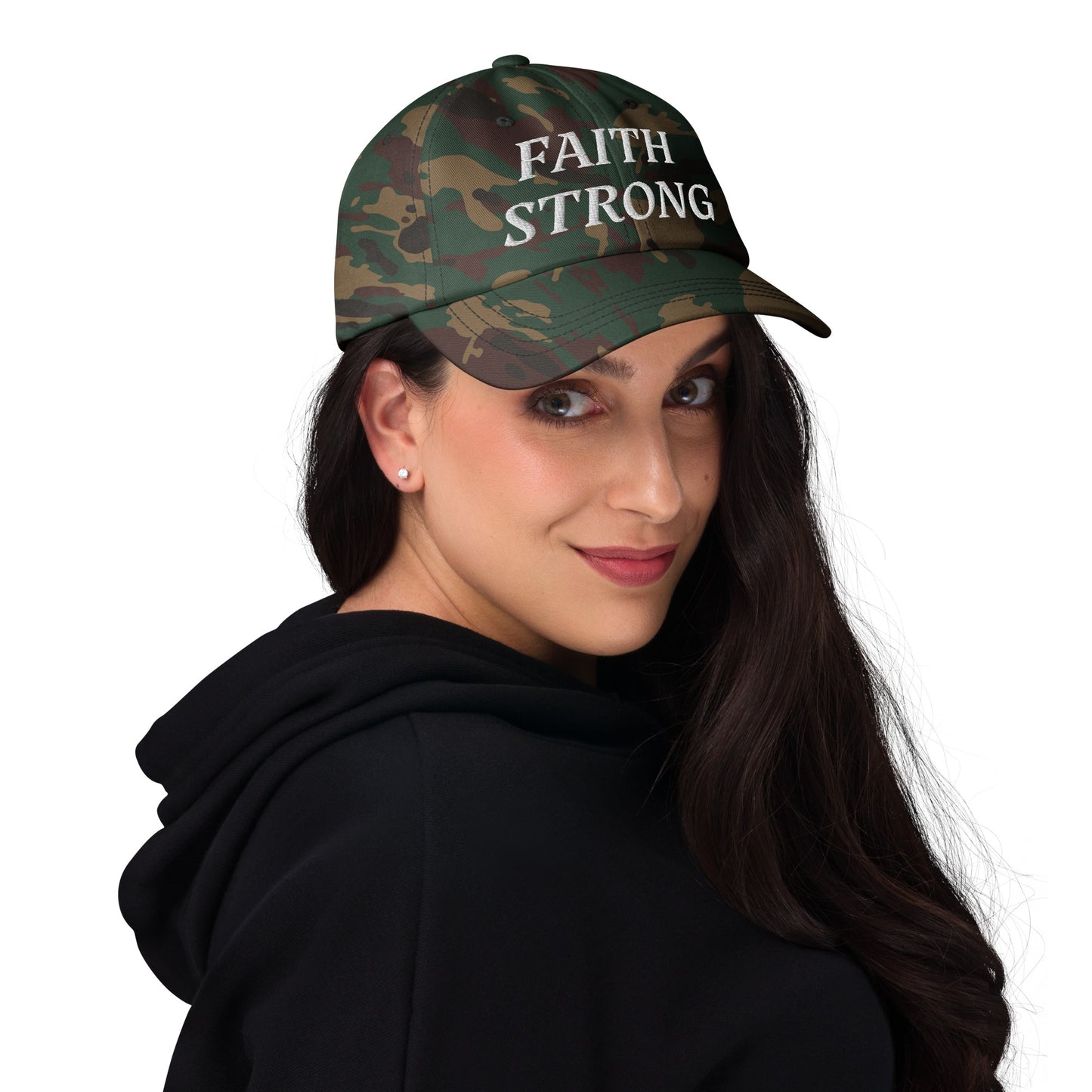 Faith Strong hat – classic white embroidery, adjustable unisex cap available in multiple colors by ReBirth Living. The model has on the green camo hat with white embroidery.