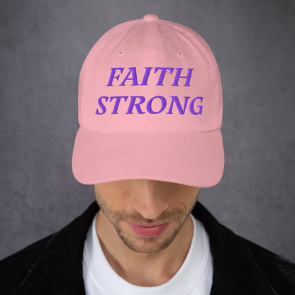 Model is wearing a Faith Strong embroidered hat – bold purple text, pink adjustable unisex cap by ReBirth Living