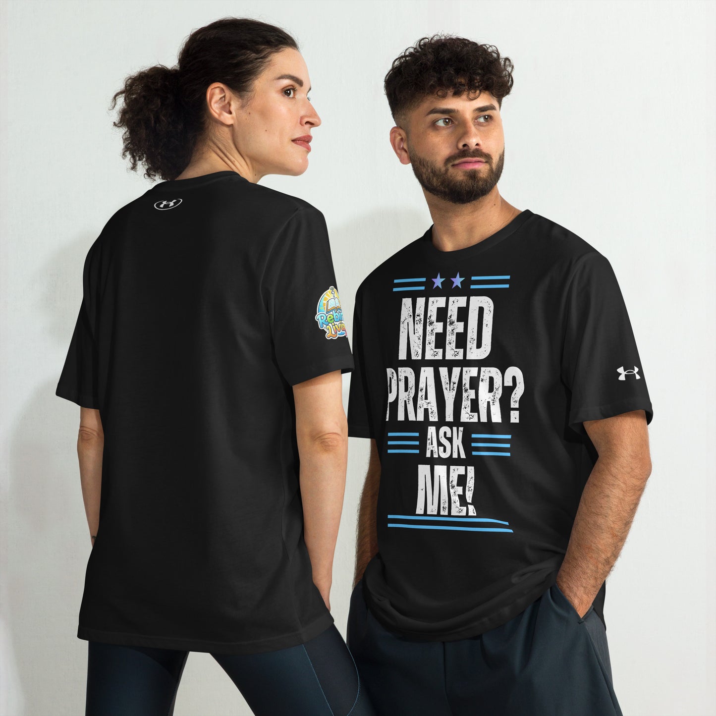 Two people wearing a Need Prayer? Ask Me! Christian performance t-shirt – unisex Under Armour shirt, black, moisture-wicking athletic faith apparel by ReBirth Living