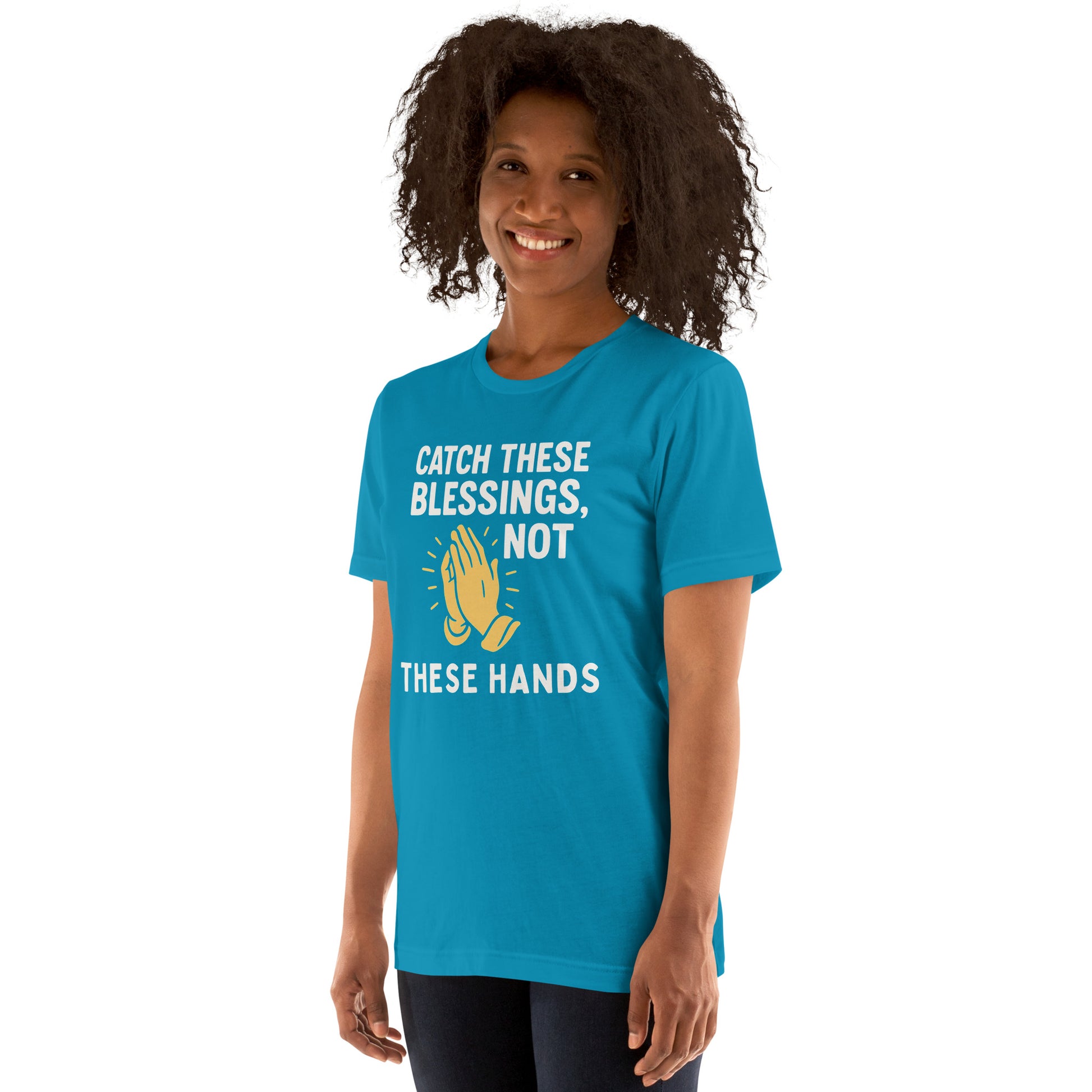 Model showcasing a Catch These Blessings, Not These Hands – funny Christian t-shirt, aqua, faith-based humor design with prayer hands by ReBirth Living