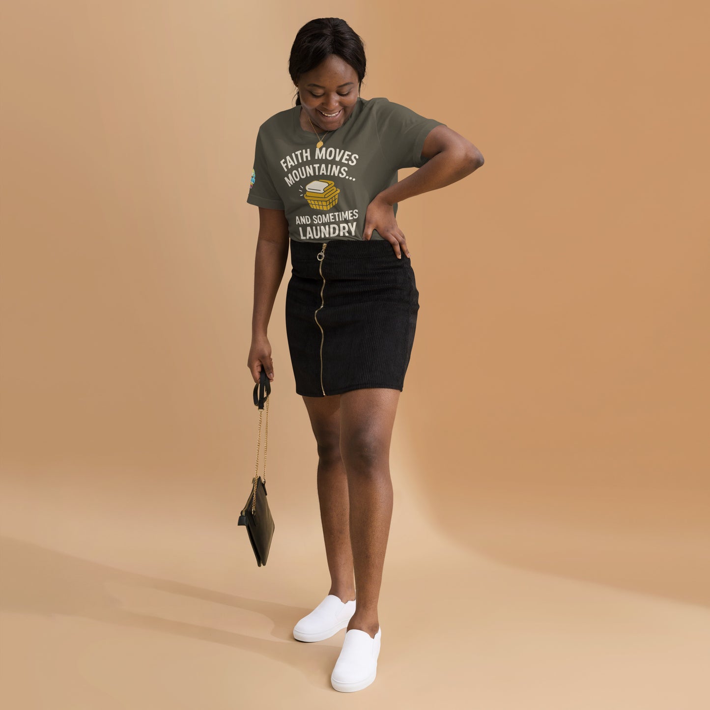 Model showcasing a Faith Moves Mountains… and Sometimes Laundry – funny Christian t-shirt, army, faith-based humor design by ReBirth Living