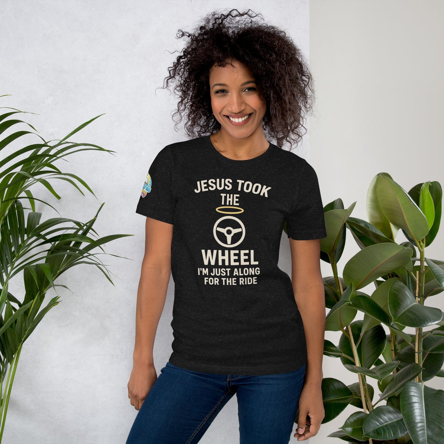 Model showcasing a Jesus Took the Wheel – I’m Just Along for the Ride – funny Christian t-shirt, black heather, faith humor design by ReBirth Living