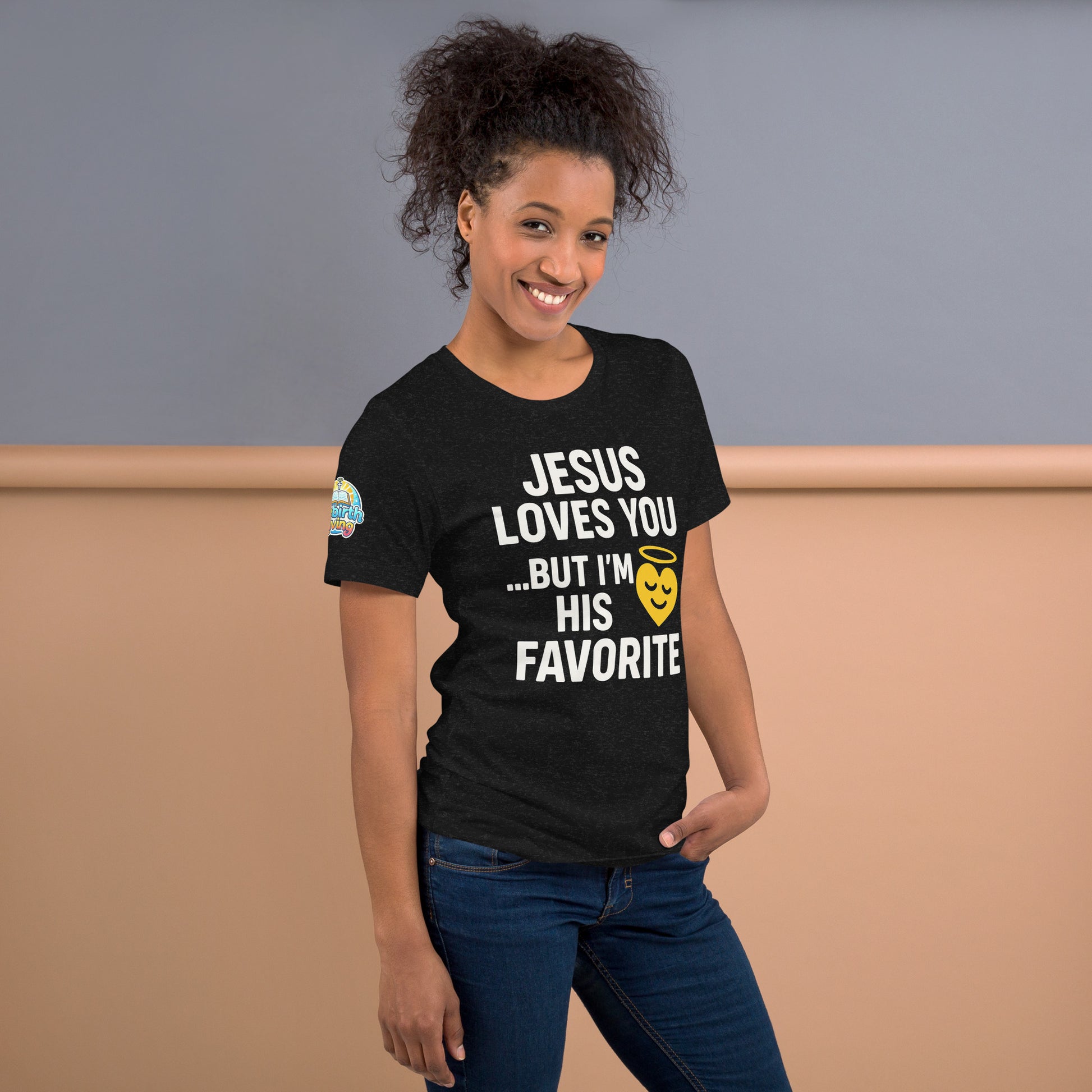 Model wearing “Jesus Loves You… But I’m His Favorite” – funny Christian t-shirt, black heather, faith humor design with golden smiling heart and halo by ReBirth Living
