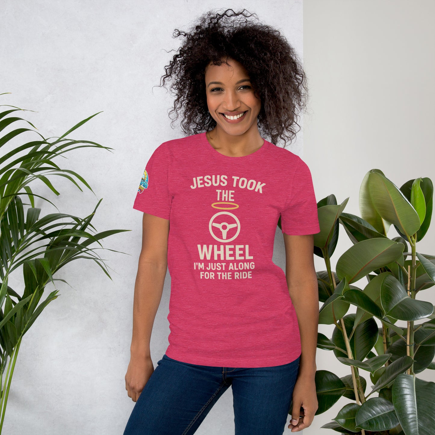 Model showcasing a Jesus Took the Wheel – I’m Just Along for the Ride – funny Christian t-shirt, heather raspberry, faith humor design by ReBirth Living