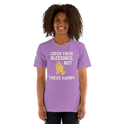 Model showcasing a Catch These Blessings, Not These Hands – funny Christian t-shirt, heather team purple, faith-based humor design with prayer hands by ReBirth Living