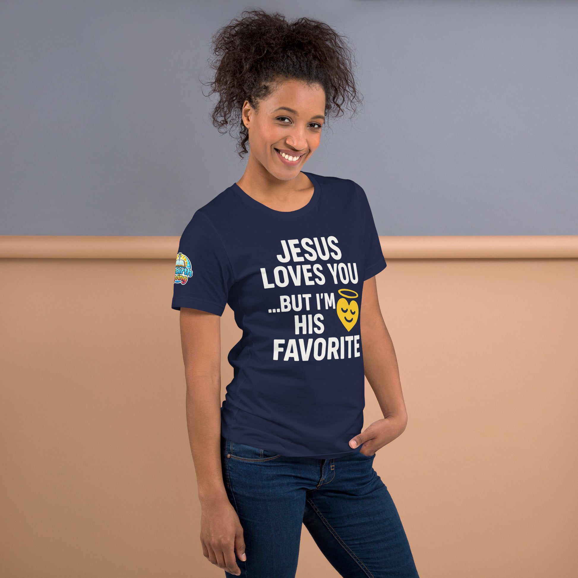 Model wearing “Jesus Loves You… But I’m His Favorite” – funny Christian t-shirt, navy, faith humor design with golden smiling heart and halo by ReBirth Living