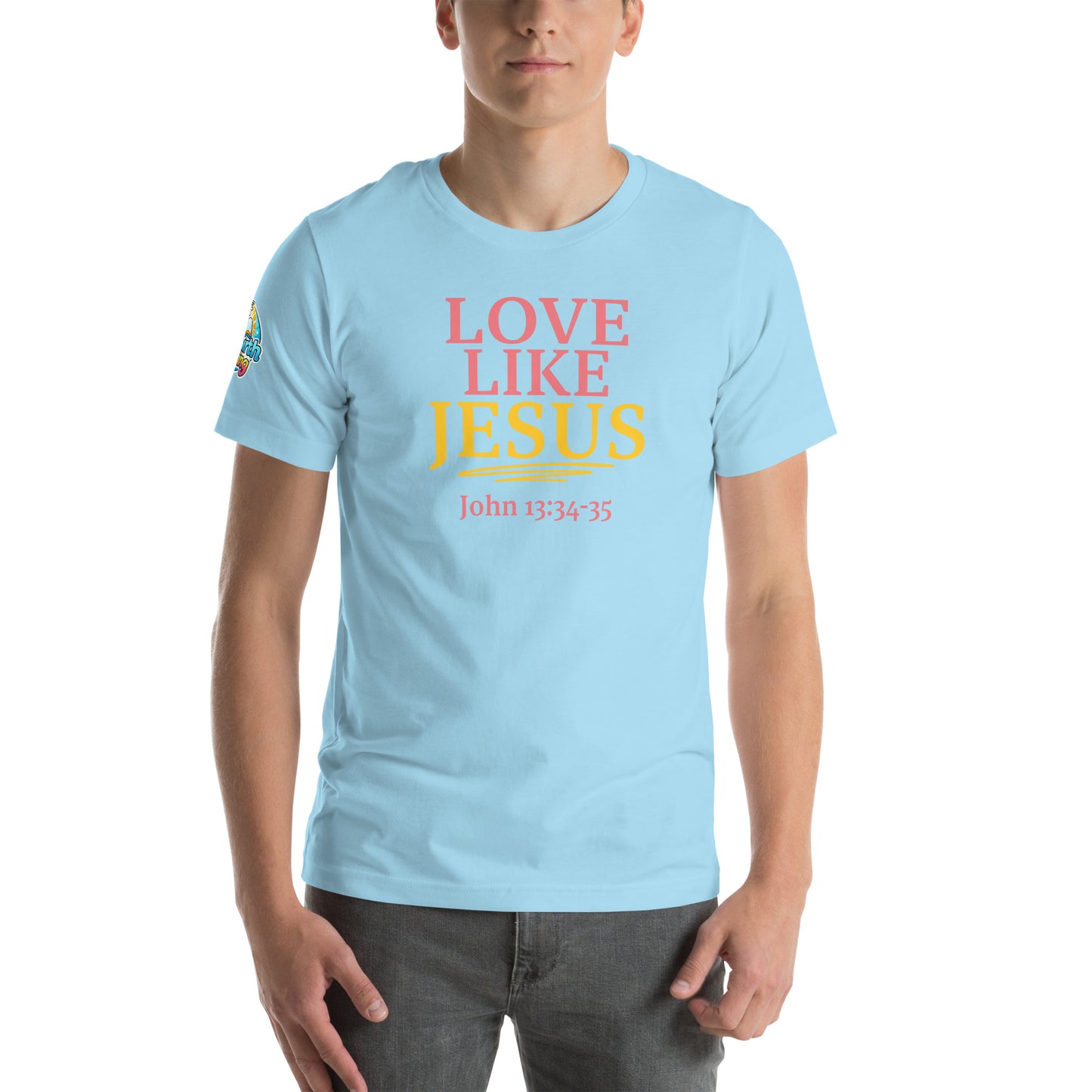 A person is wearing a Love Like Jesus Christian t-shirt – bold faith graphic tee for men and women, ocean blue, unisex design by ReBirth Living