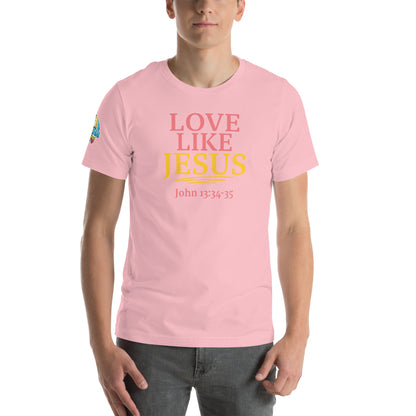 A person is wearing a Love Like Jesus Christian t-shirt – bold faith graphic tee for men and women, pink, unisex design by ReBirth Living