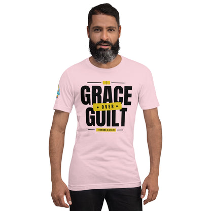 A Person is wearing a Grace Over Guilt Christian unisex t-shirt – Romans 5:20–21 KJV scripture design, soft pink, faith-based apparel by ReBirth Living