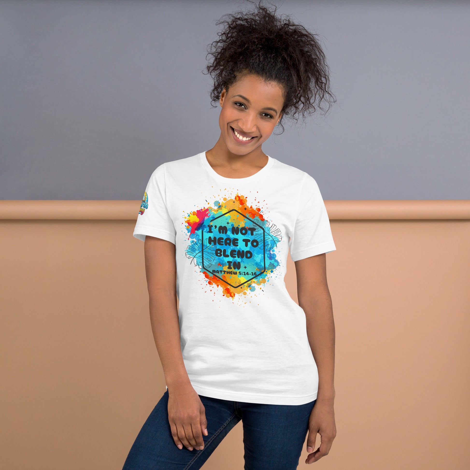 A person is wearing a I’m Not Here to Blend In Christian unisex t-shirt – Matthew 5:14–16 KJV scripture design, white, faith-based apparel by ReBirth Living